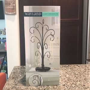 Sculpted metal jewelry tree.